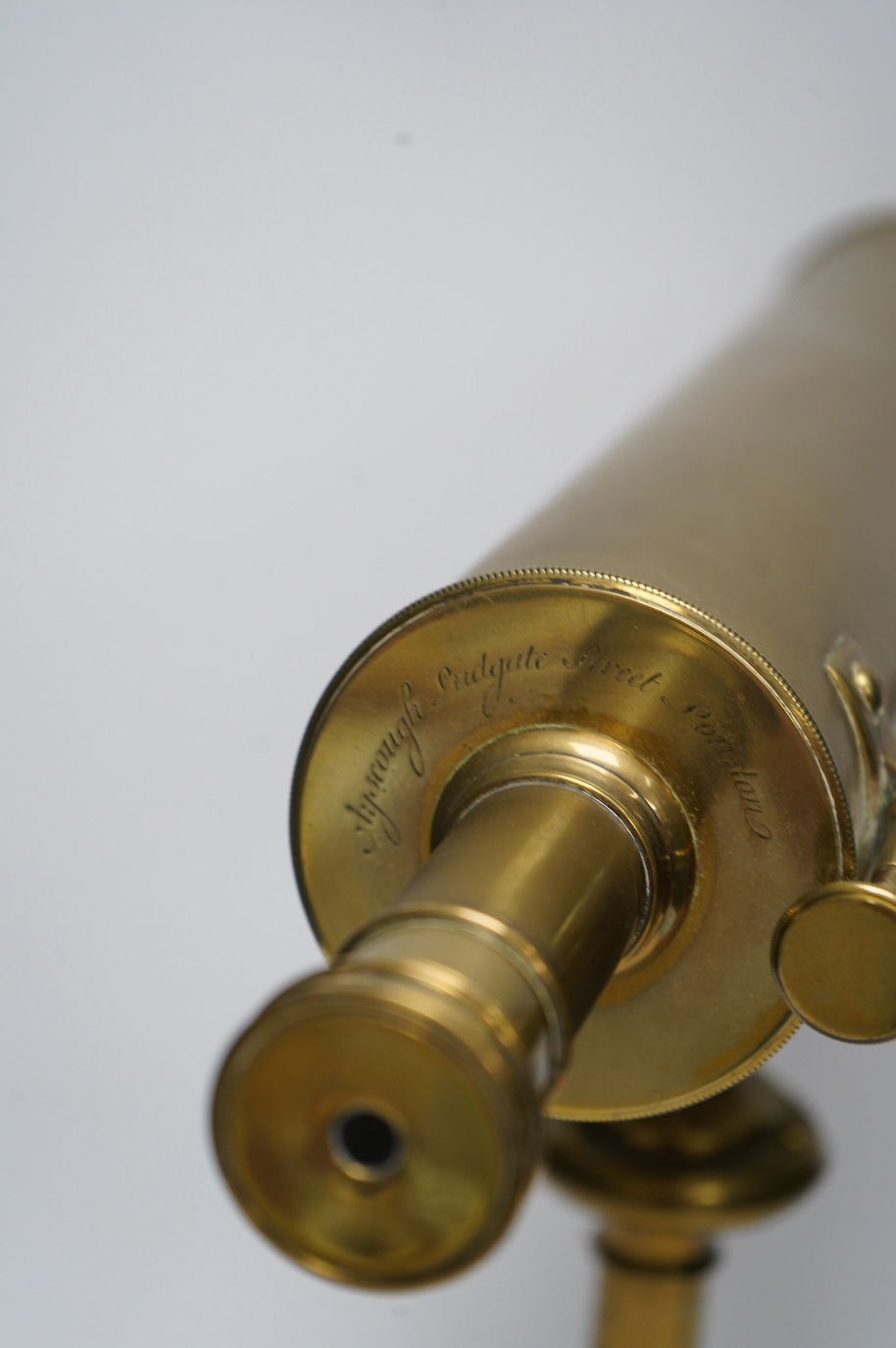 A portable brass reflector telescope on a tripod stand, engraved Ayscough, 44.5cm long. Condition - fair